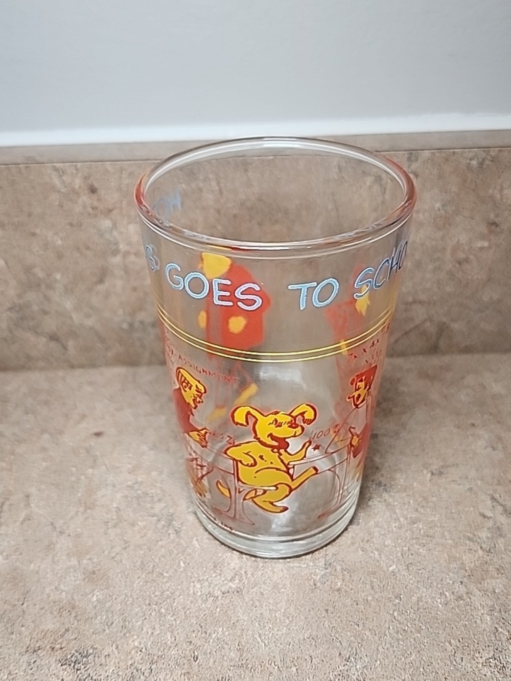 Vintage School-Themed Glass Cup with Yellow and Orange Graphics